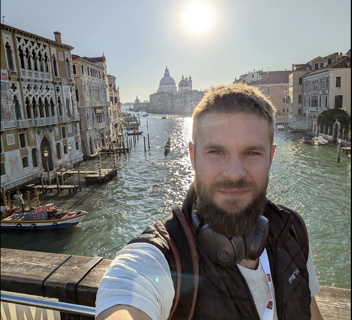 Davide on the Accademia bridge in Venice, with Palazzo Cavalli-Franchetti to his left